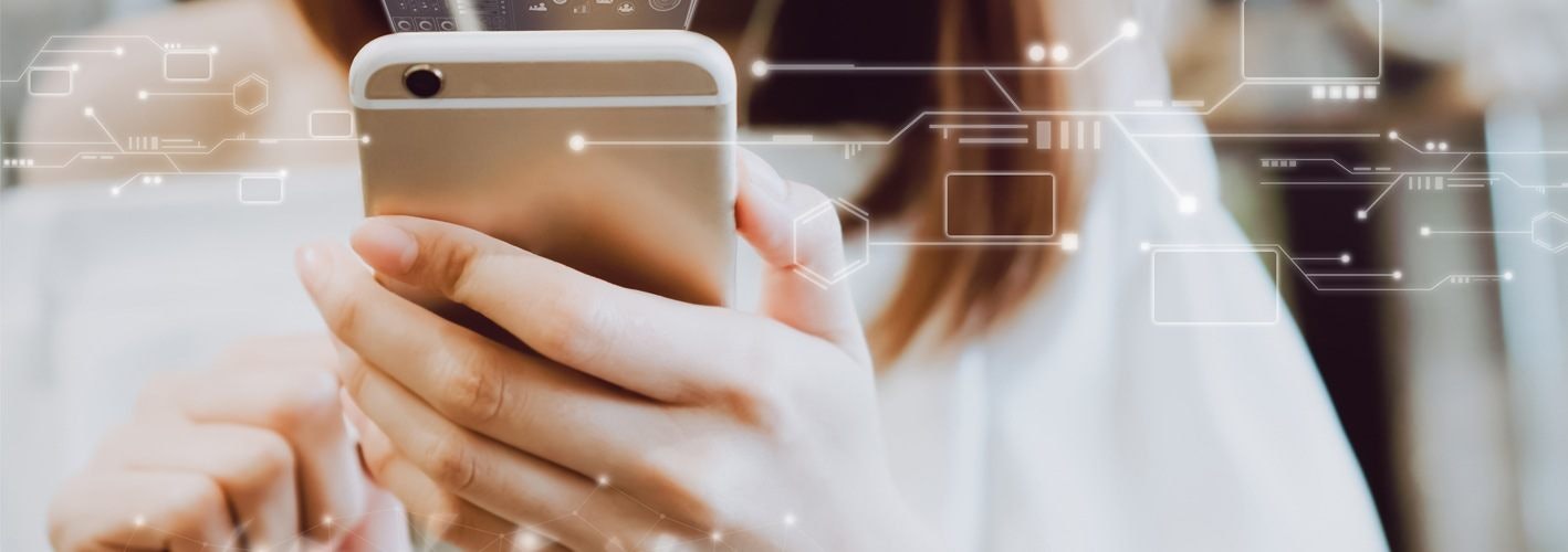 woman using smartphone as code matrix emanates from it